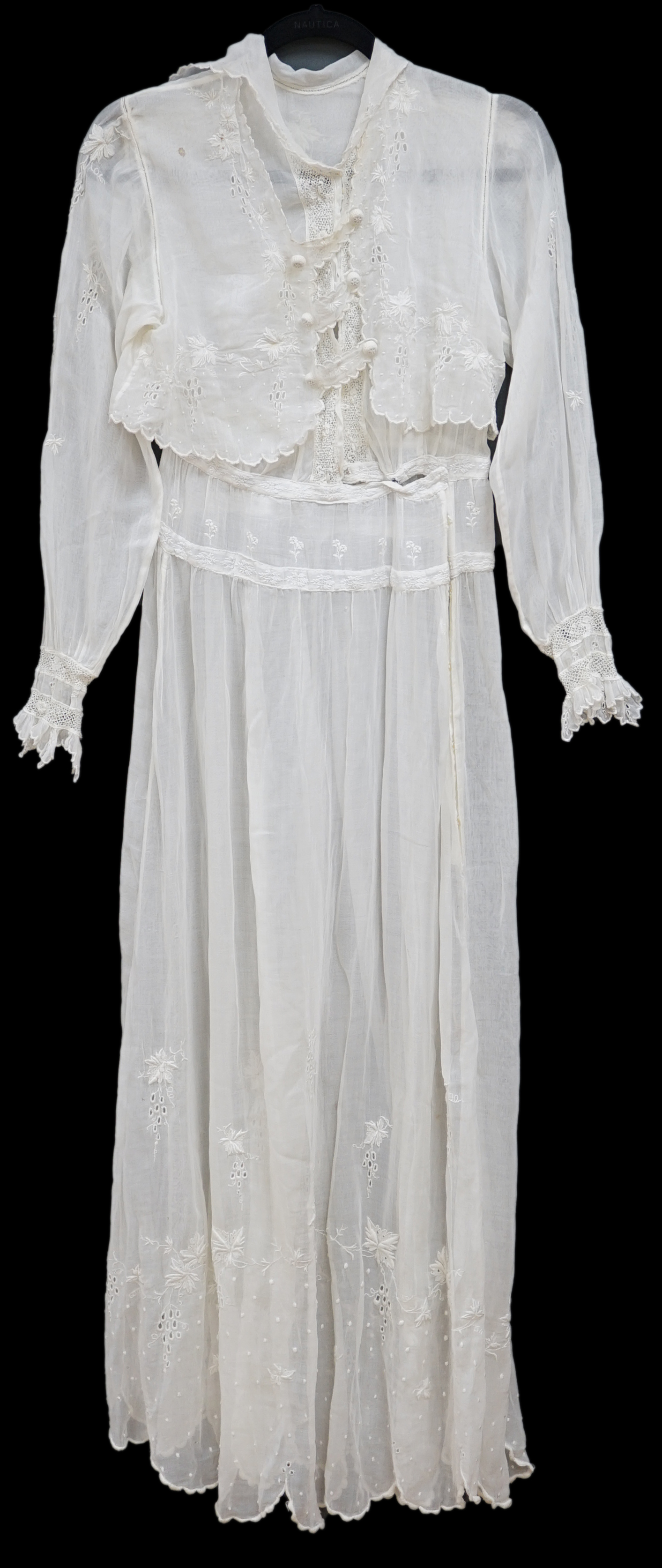 An early Edwardian fine lawn ladies hand made and embroidered crochet dress, embroidered with a white worked skirt, cuffs and lower waist and Irish crochet bodice insertions, with novelty detailing of a faux jacket front